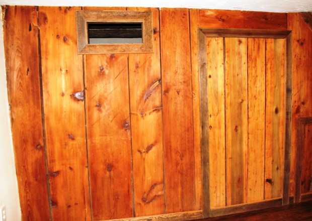 The original cabin door remains, though sealed closed.