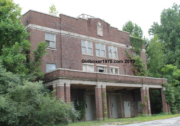 Large brick building with bolted metal doors.