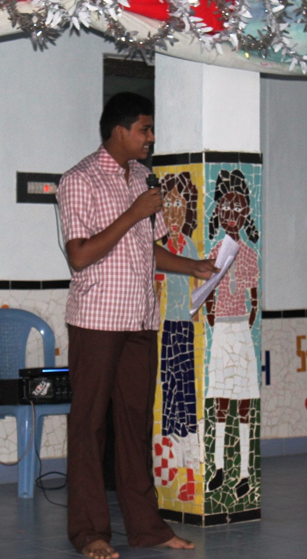 Richard, the best English speaking student at HOINA, translates and takes photos.